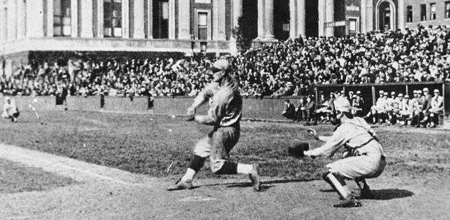 Lou Gehrig ’23 swings for the fences, or maybe Journalism, as fans fill the bleachers on what now is Van Am Quad.